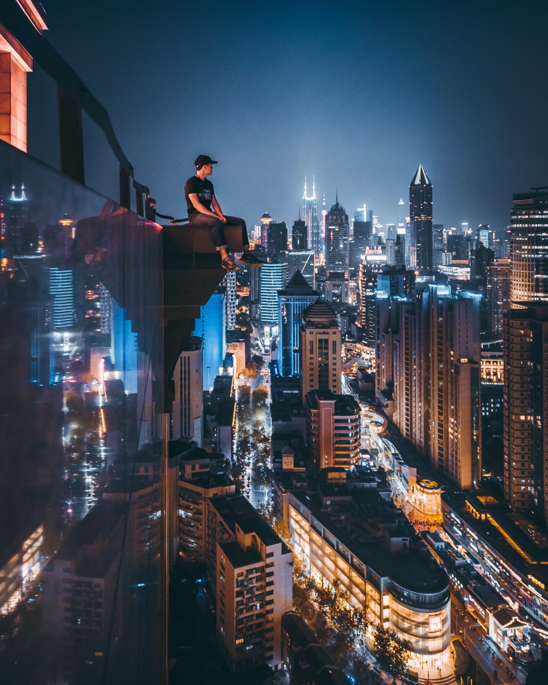 urban, city, sky, 2K, sitting, adventure, night, illuminated, man, looking out, city life, crowd, office building exterior, lifestyles, residential district