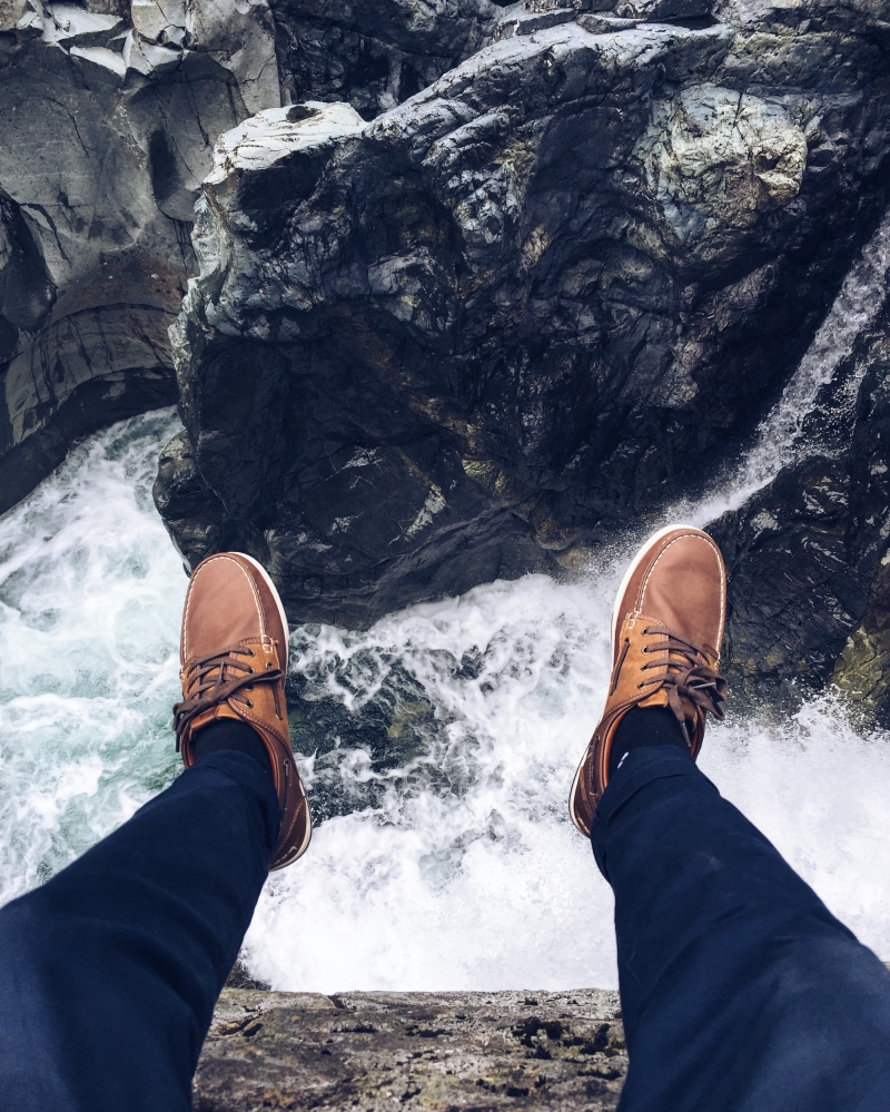 shoe, water, rock, beauty in nature, lifestyles, people, human body part, taking, rapid, near, sitting, flowing, dark, picture, feet, human leg, lake, men