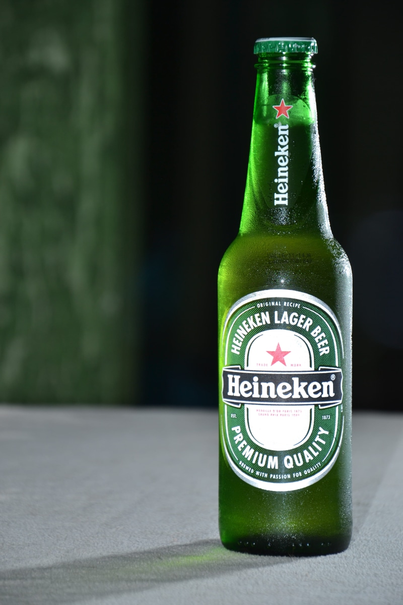 western script, food and drink, beer, still life, no people, freshness, beer - alcohol, label, green, heineken, green color, single object, brightness