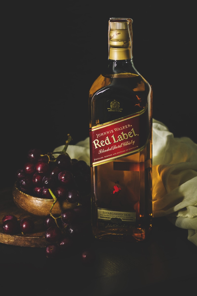 studio, text, refreshment, glass, bowl, fruit, red label, quezon city, black background, indoors, beverage, johnnie walker, wine bottle, bottle, whiskey