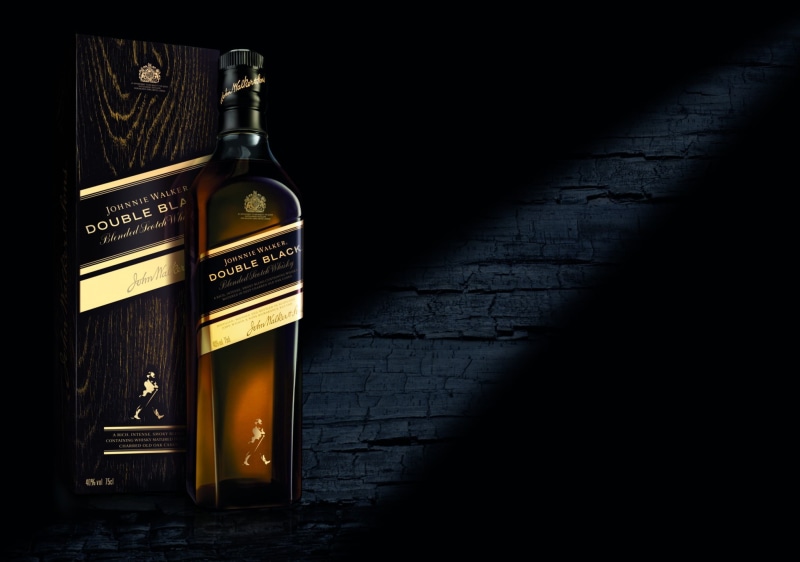 food and drink, boxes, communication, food, copy space, dark, text, wine bottle, indoors, container, black, wall, box, Johnnie Walker, whisky, still life