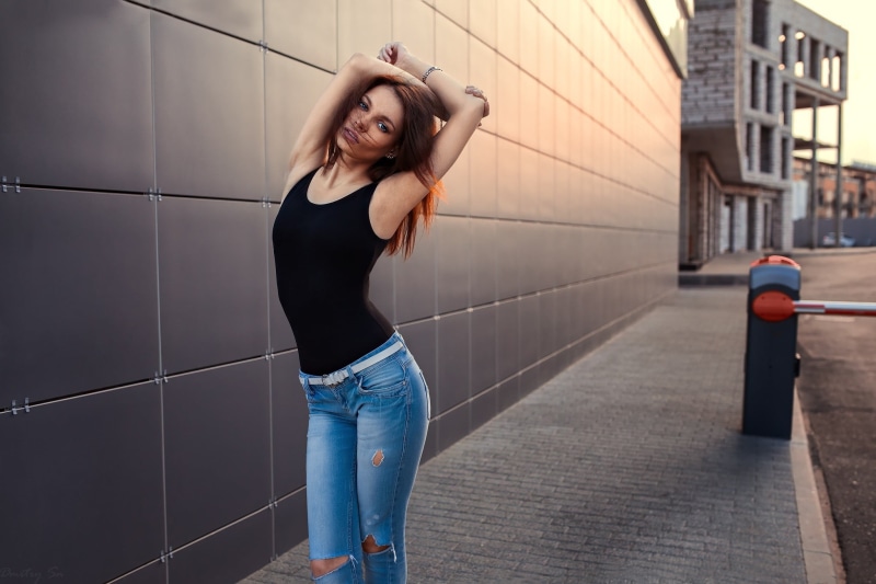 long hair, hairstyle, straight hair, clothing, tank, 1080P, looking at viewer, young women, women, real people, tight clothing, model, jeans, top, built structure