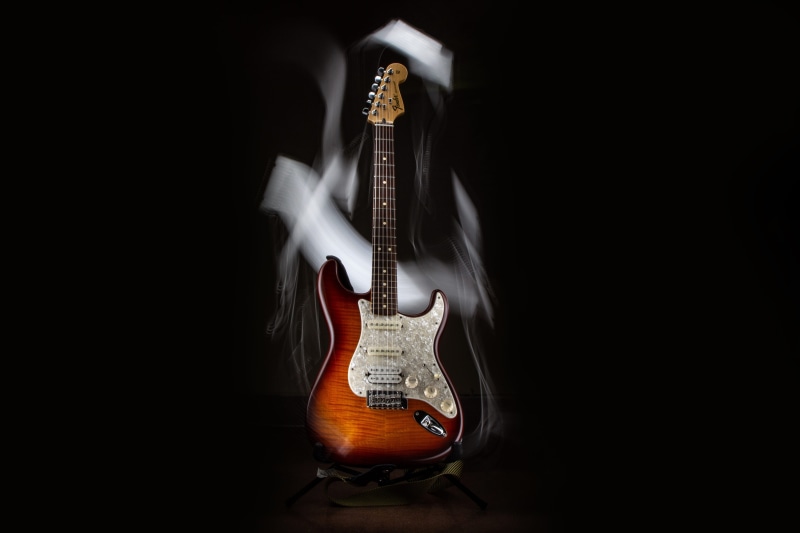 still life, arts culture and entertainment, acoustic guitar, black background, guitar, rock, no people, fender, string, wood - material, close-up, musical equipment