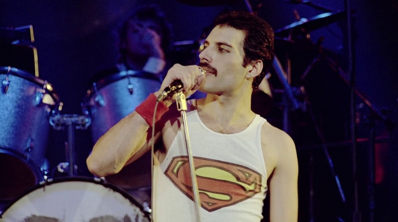 enjoyment, musician, young adult, Superman, night, skill, nightlife, live event, musical equipment, indoors, stage - performance space, musical instrument