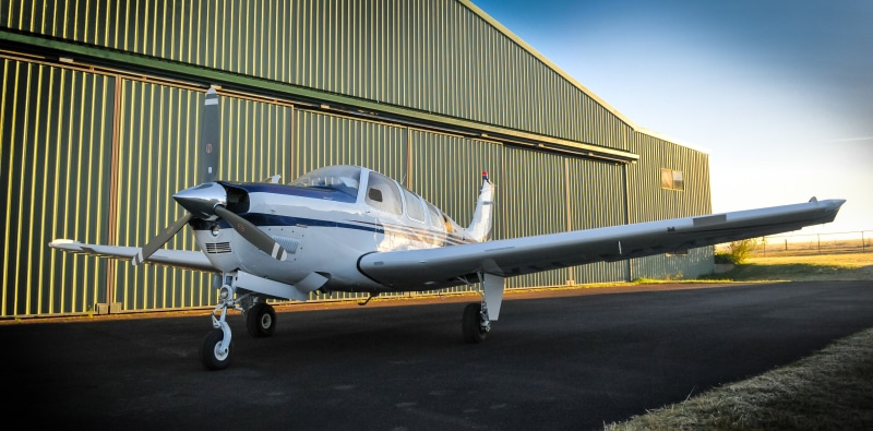 mode of transportation, hangar, corporate jet, arrival, transportation, sky, travel, airport runway, outside, aircraft wing, aviation, airplane, business