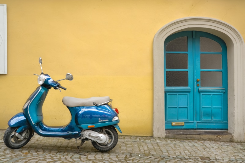 window, beside, wall - building feature, transportation, land vehicle, building exterior, no people, wall, double door, yellow, yellow stucco, door, outside