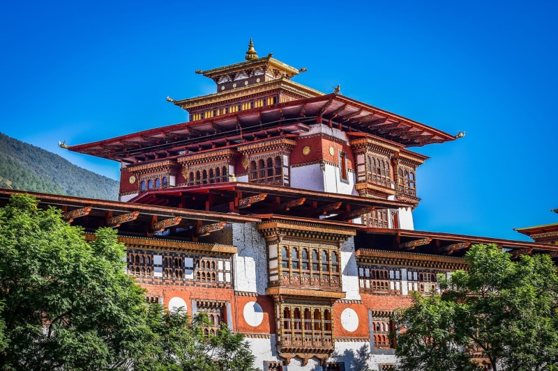 dzong, old, 1080P, clock, clear sky, sky, structure, landmark, nature, building, low angle view, tourist, no people, punakha, building exterior, eastern
