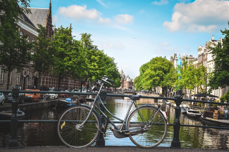 city Life, transportation, mode of transportation, building exterior, land vehicle, cloud - sky, bridge - Man Made Structure, urban, Bicycle, urban Scene