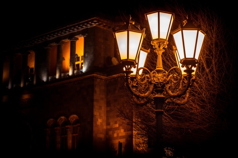low angle view, concrete, lamp post, travel destinations, downtown, dark, light, building, lighted, road, illuminated, luxury, street, hanging, cityscape