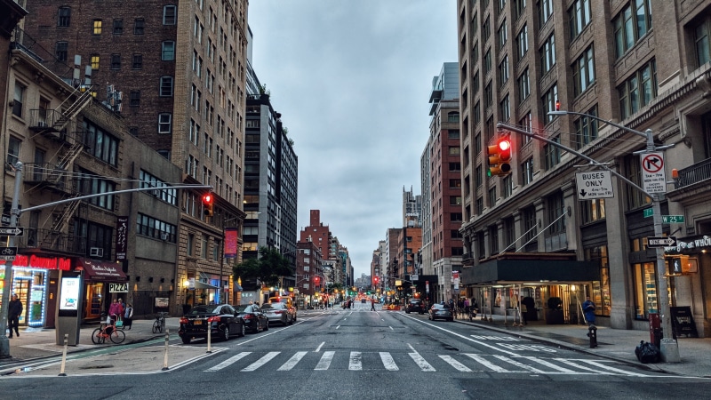 car, light, city, buildings, near, blonde, outdoors, nyc, sky, symbol, built structure, pedestrian, manhattan, perspective, high, architecture, white, urban