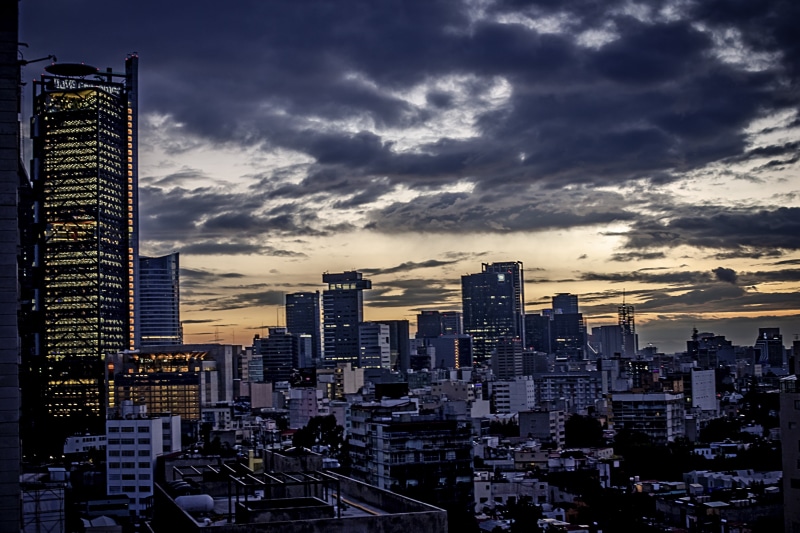 sunset, mexico city, outdoors, sky, cloudy, skies, tall - high, built structure, urban, building, building exterior, urban skyline, nature, no people, skyscraper