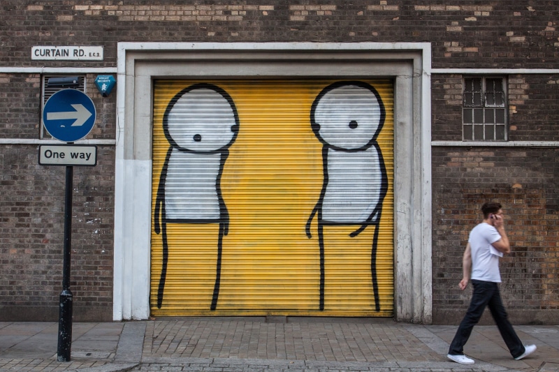 brick, man, one person, real people, building Exterior, adult, young adult, built Structure, East London, adults only, standing, one, graffiti, east, full length