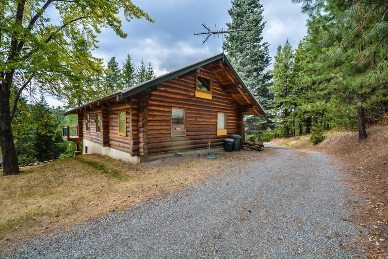 house, mountains, brown, rural, no people, building, log home, day, wooden, forest, non-urban scene, growth, privacy, rustic, log cabin, cloud - sky, outdoors