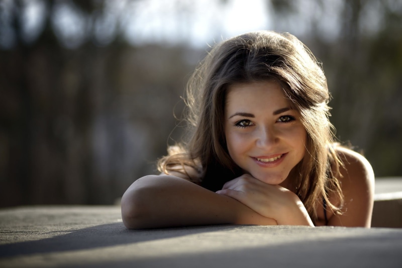 lying on front, pink, brown eyes, Dana Kareglazaya, selective focus, beautiful woman, 1080P, lying down, long hair, looking at camera, beauty, women, brunette