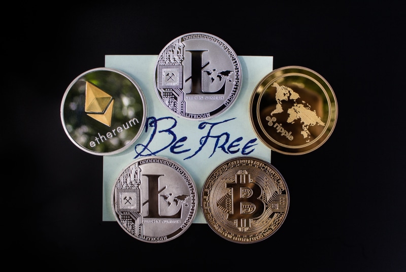 group of objects, silver, payment, cryptocurrency, cryptography, wealth, coins, representation, currency, indoors, litecoin, blockchain, cash, text, black background