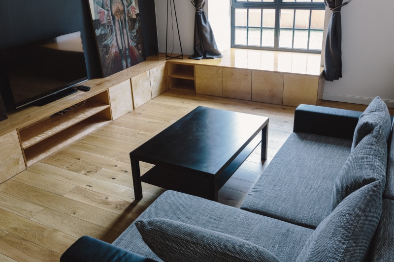 full, domestic Room, home Interior, wood, interior, brick walls, table, chair, paintings, window, living Room, day, coffee table, comfortable, apartment