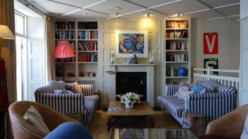 home showcase interior, couch, coffee table, striped, lamp, bookshelf, domestic room, furniture, interior, domestic life, luxury home interior, sofa, design
