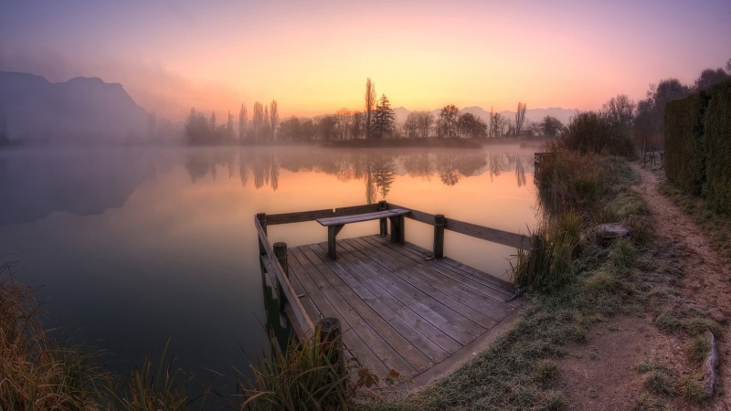 lake, landscape, wooden, brown, water, mist, balcony, sky, bench, tranquility, shrubs, trees, orange color, nature, non-urban scene, beauty in nature, plant