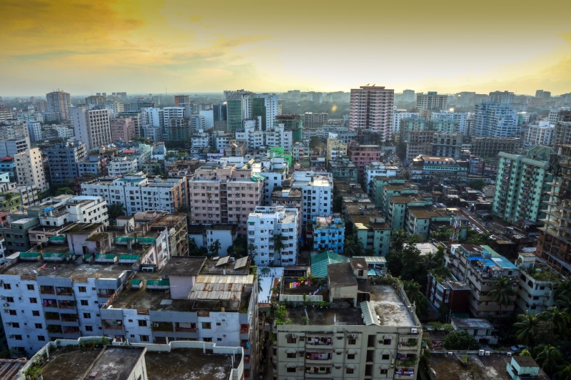 building exterior, cityscape, high angle view, cloud - sky, skyscraper, building, outdoors, settlement, community, dhaka, tall - high, built structure