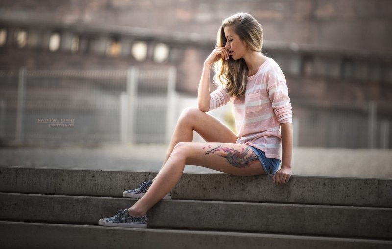 women, long hair, architecture, sitting, day, blond hair, young adult, full length, leisure activity, staircase, tattoo, one person, steps and staircases