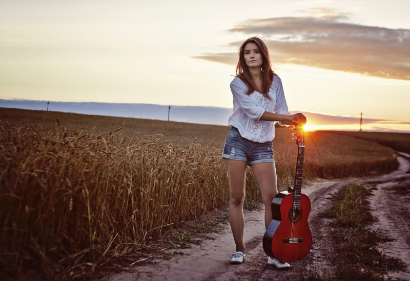 white, shirt, blue, standing, beautiful woman, casual clothing, brunette, spikelets, holding, front view, 1080P, denim, young adult, jean shorts, sleeved