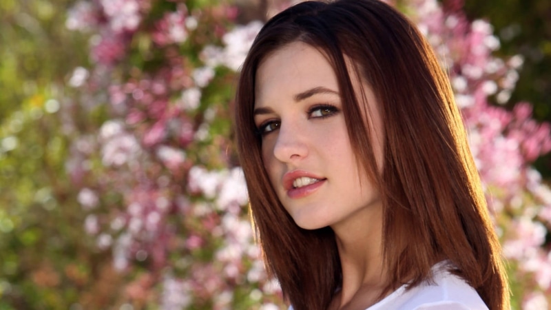 s, brunette, flower, brown hair, Kasey Chase, smiling, looking at viewer, portrait, hairstyle, long hair, beauty in nature, adult, nature, outdoors, 1080P