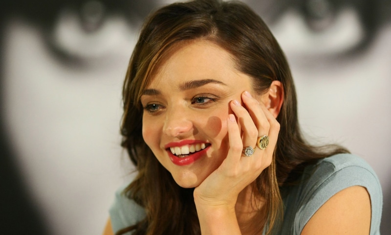 human body part, looking at camera, smiling, hair, hairstyle, women, blue eyes, headshot, portrait, human hand, young adult, hands covering mouth, hand