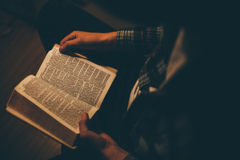 one man only, bible, arts culture and entertainment, holy, creativity, spirituality, alone, dark, one person, indoors, inside, adults only, black background