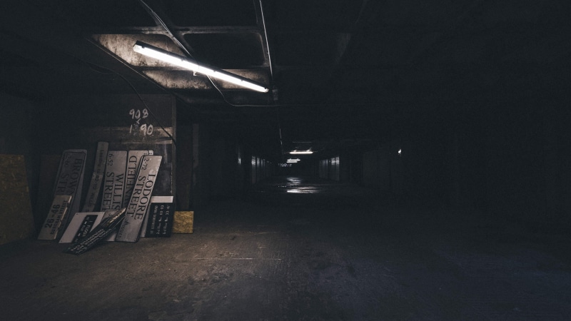 music, built structure, empty, seat, parking garage, nature, basement, bench, lighting equipment, 2K, dark, signboards, light, no people, spooky, indoors