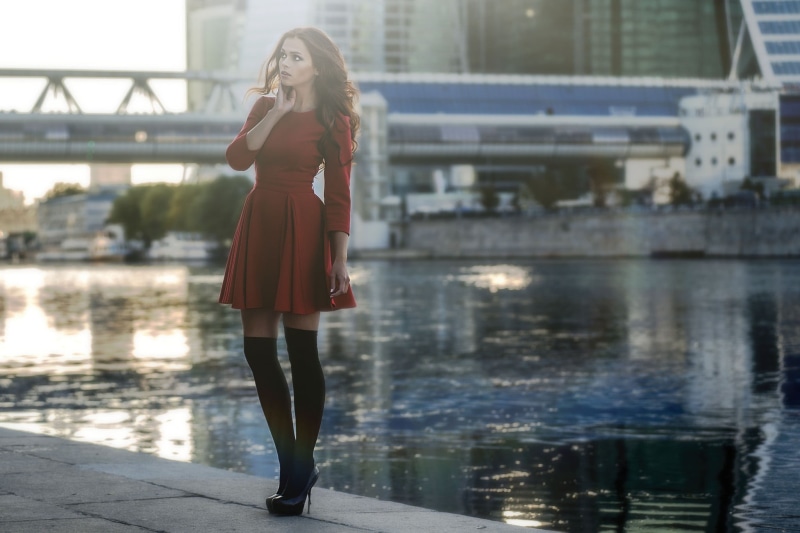 stockings, real people, hairstyle, portrait, skinny, high heels, minidress, building exterior, water, one person, beauty, young women, looking away, beautiful woman