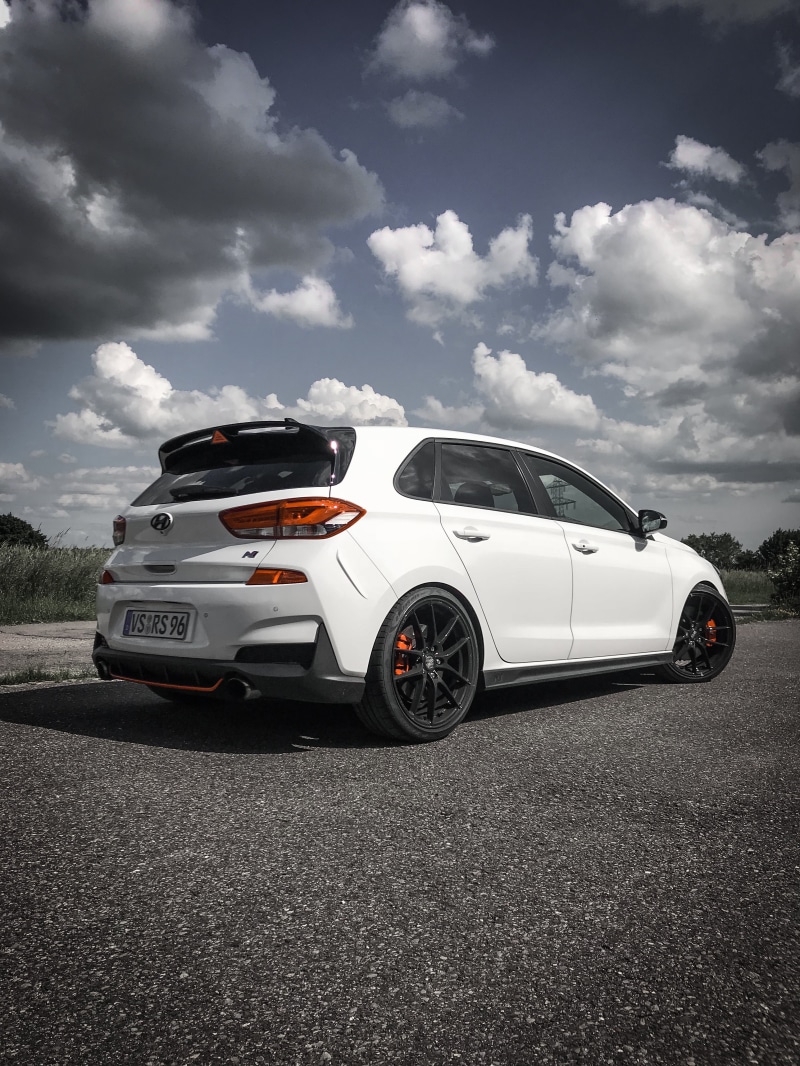 outdoors, i30N, hot hatch, sky, rear angle view, hatchbacks, mode of transportation, cloud - sky, car, Hyundai, motion, luxury, city, motor vehicle, street