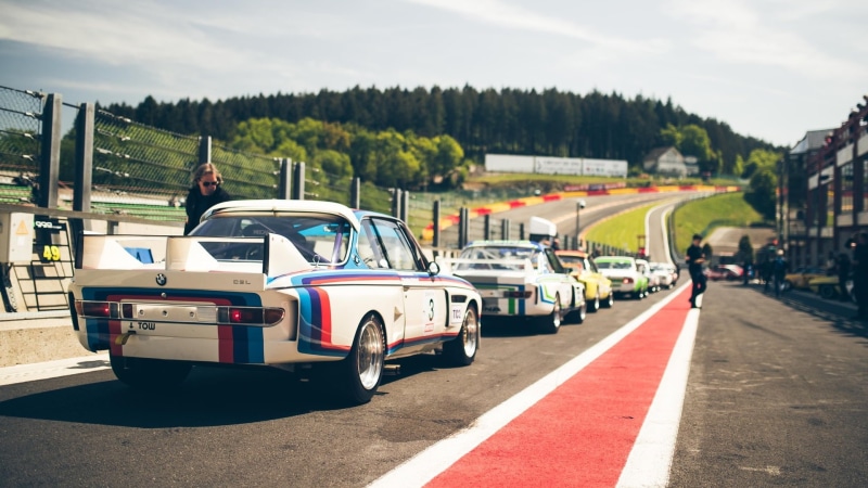 real people, building exterior, tree, built structure, land vehicle, outdoors, BMW 3.0 CSL, nature, transportation, day, rear angle view, sky, 1080P, Spa Francorchamps