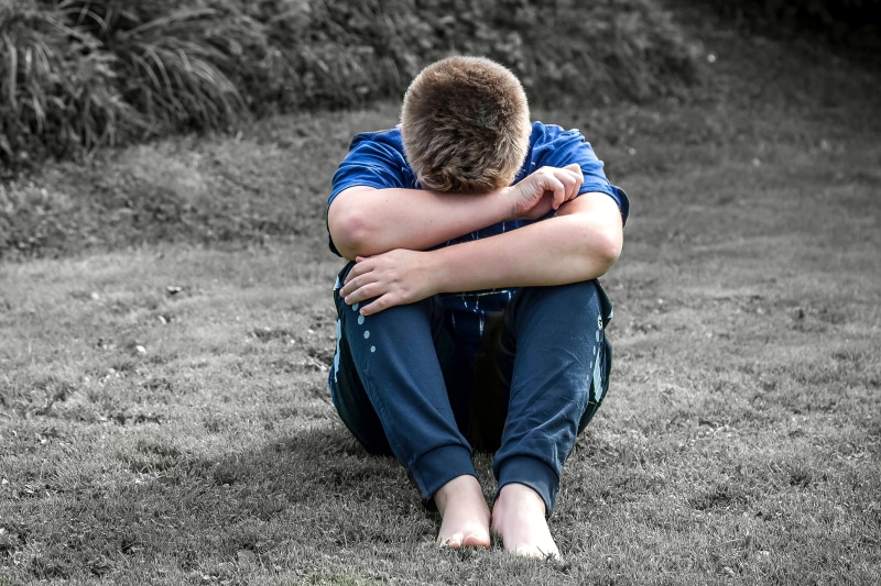 offspring, unhappy, field, cry, grassland, rest, arm around, sad, men, real people, full length, grass, young, problem, park, boys, emotion, cute, portrait