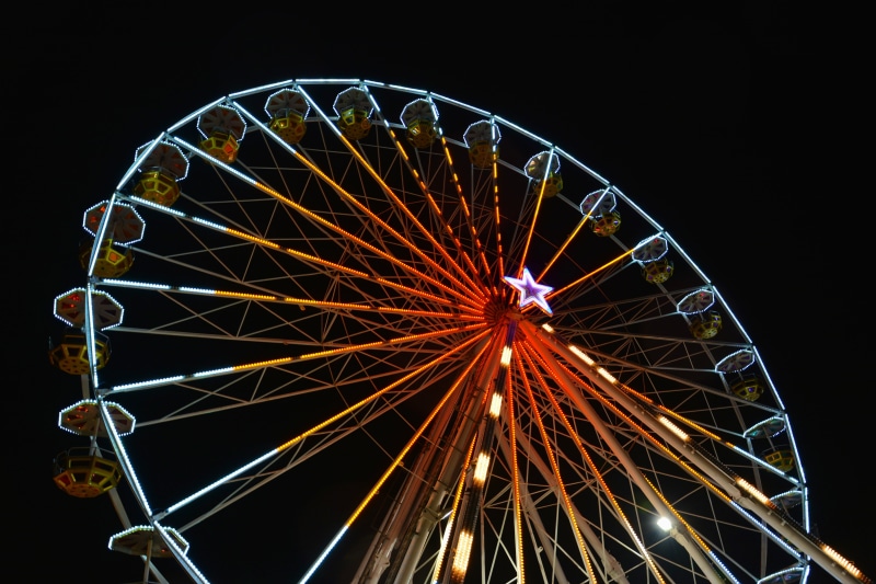 amusement park ride, no people, shape, enjoyment, fun, sky, lights, carnival, arts culture and entertainment, leisure activity, low angle view, night, wheel