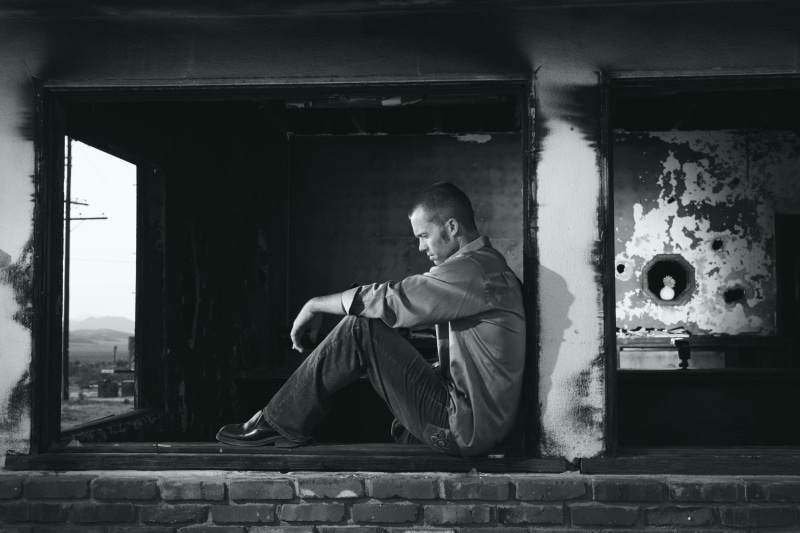 window, building, built structure, depressed, contemplation, casual clothing, sad, males, day, young, depression, thinking, adult, architectural column