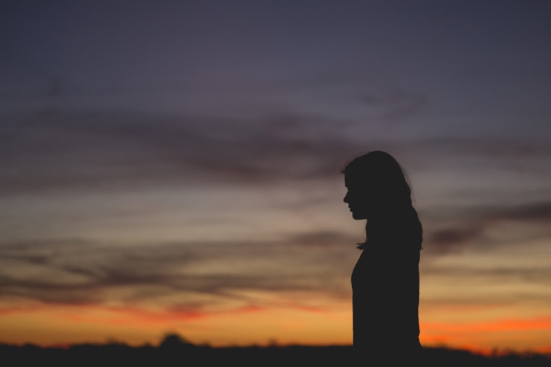 lonely, beauty in nature, nature, leisure activity, dark, lifestyles, one person, silhouette, sunset, depression - sadness, waist up, outdoors, alone, worry