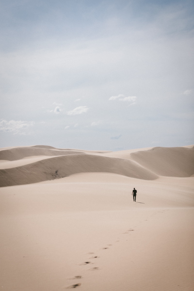landscape, scenics - nature, tranquil scene, explorer, sky, waling, desert, one person, beauty in nature, tranquility, leisure activity, non-urban scene