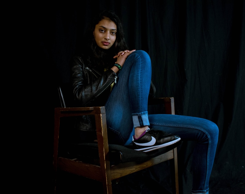 leisure activity, brown, looking, jeans, teenager, seat, armchair, wearing, young adult, person, furniture, pose, adult, casual clothing, portrait, girl