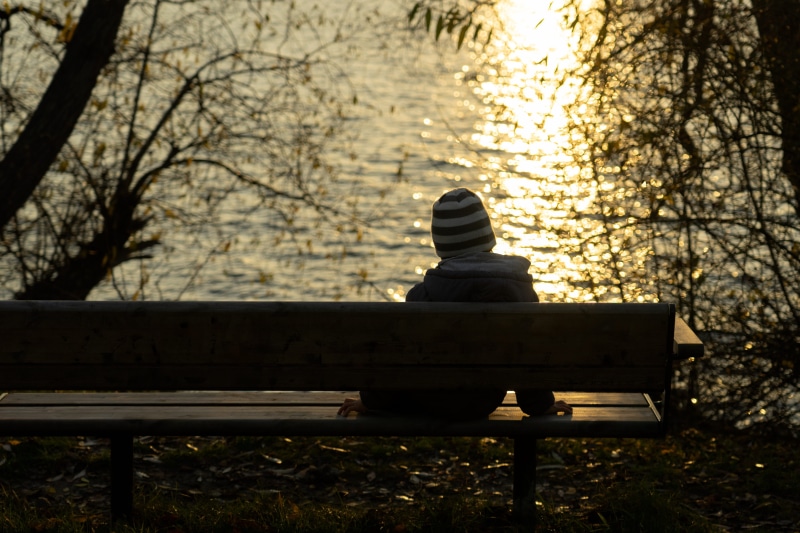 land, real people, child, lonely, park bench, tree, nature, warm clothing, bench, park - man made space, abandoned, one person, relaxation, sun, lifestyles