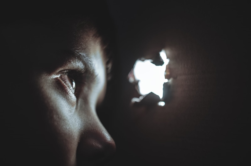 adults only, torn, looking, childhood, sadness, togetherness, headshot, game, one person, young adult, spy, box, hide, abuse, men, emotion, indoors, little
