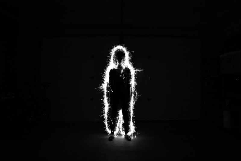 black background, motion, guy, illuminated, darkness, light - natural phenomenon, blur, spark, halloween, glowing, full length, adults only, digital composite