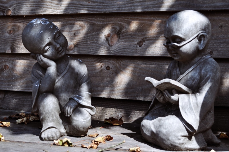daydreaming, human representation, monk, sculpture, indoors, concrete, art and craft, statue, garden, meditation, yard, spirituality, close-up, craft, representation
