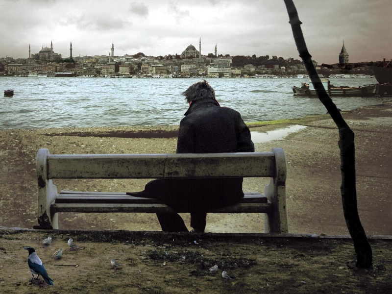 cloud - sky, warm clothing, seat, water, contemplation, nature, cityscape, real people, s, rear view, coat, alone, Turkey, built structure, full length