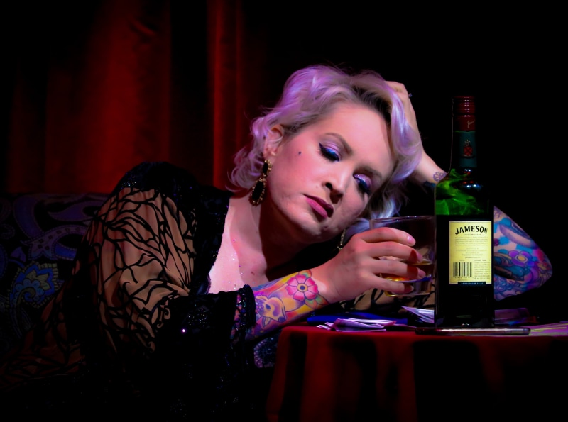 front view, person, addiction, woman, table, young women, 5K, headshot, real people, caucasian, glass, cocktail, bottle, jameson, sitting, abuse, young adult