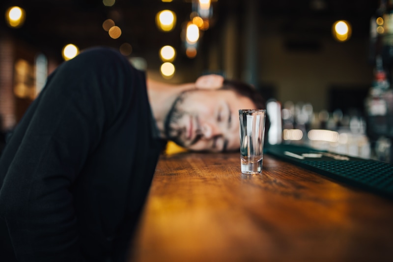 glass, only men, lifestyles, young, indoors, sitting, household equipment, one Person, alcohol, pub, lonely, males, drinking, headshot, business, drink