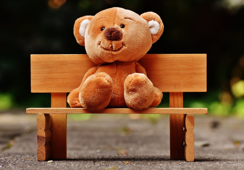 furry teddy bear, funny, fun, bench, ton, cute, outdoors, chair, animal representation, toy, focus on foreground, nature, seat, rest, bears, wood - material