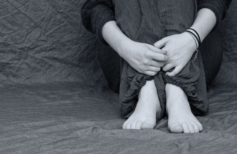 loss, black white, sleeved, human, pulled back, pleading, shirt, human limb, concern, photo, bullying, person, front view, indoors, anxious, sitting, wears