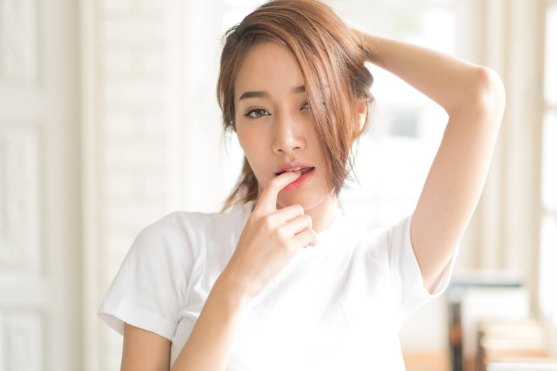 front view, headshot, one person, Pichana Yoosuk, brunette, Cup-E, hairstyle, beautiful woman, young adult, Thai, focus on foreground, hair, model, portrait