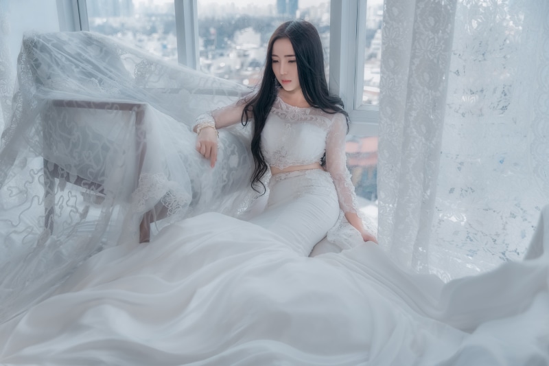 Asian, brunette, style, look, curtains, wedding dress, room, tulle, sad, hands, lace, long-haired, young, the city, fabric, luxury, pose, furniture, sitting
