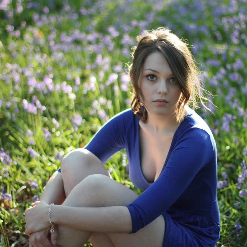 sleeved, blue, beautiful woman, long, leisure activity, Imogen Dyer, focus on foreground, beauty, nature, s, portrait, contemplation, sitting, field, looking at camera